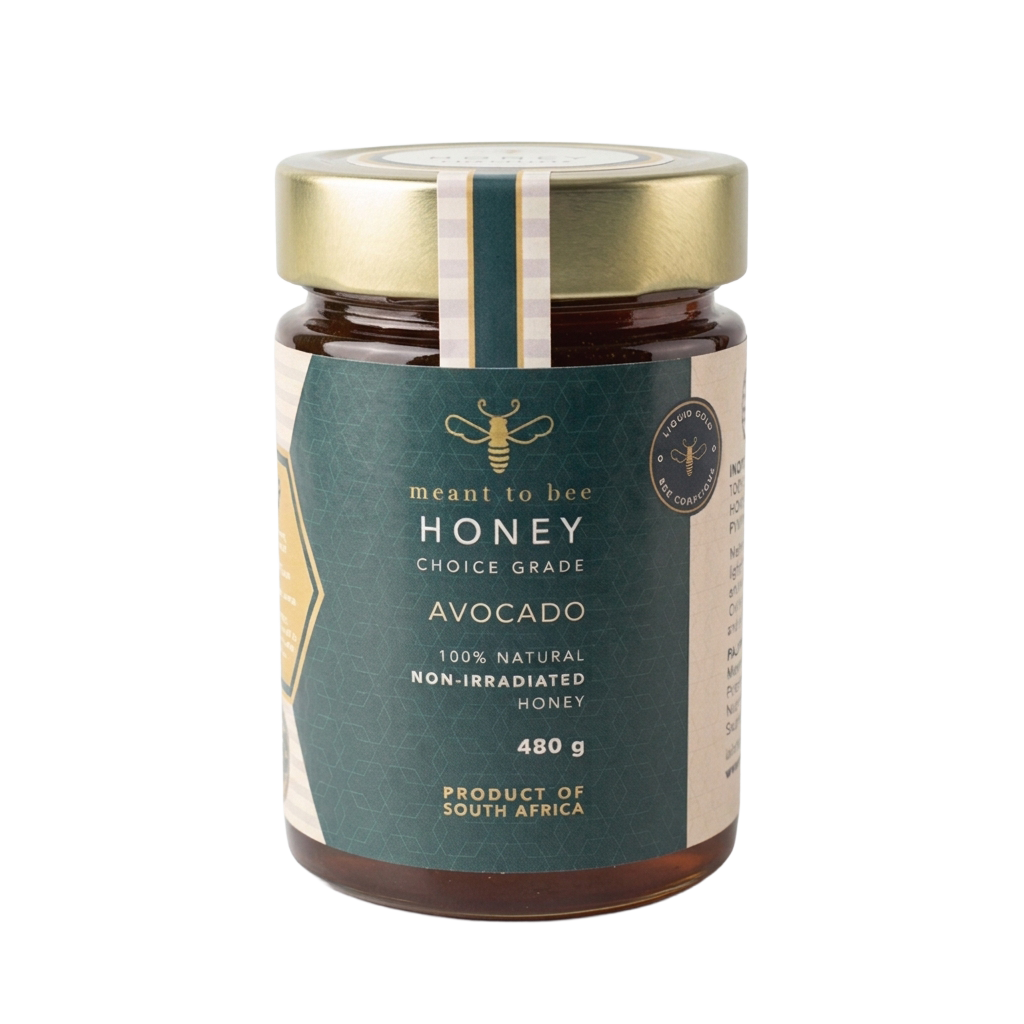 A glass jar of Meant To Bee Avocado honey with a gold lid and deep green label.